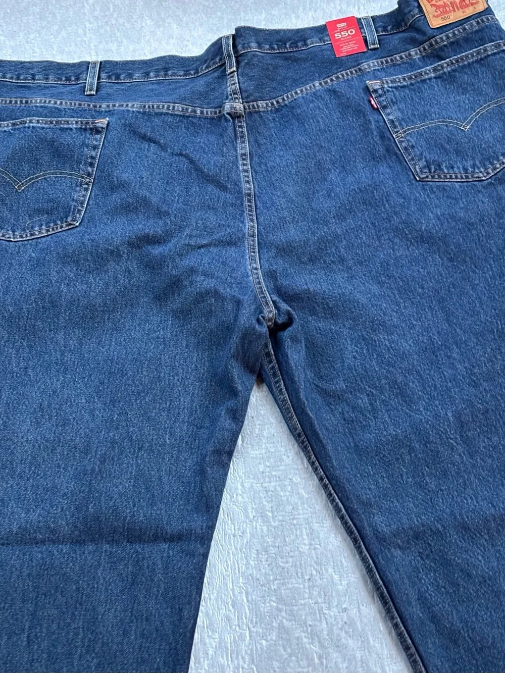 NWT Levi's 550’s with a 63W x 30L relaxed fit.